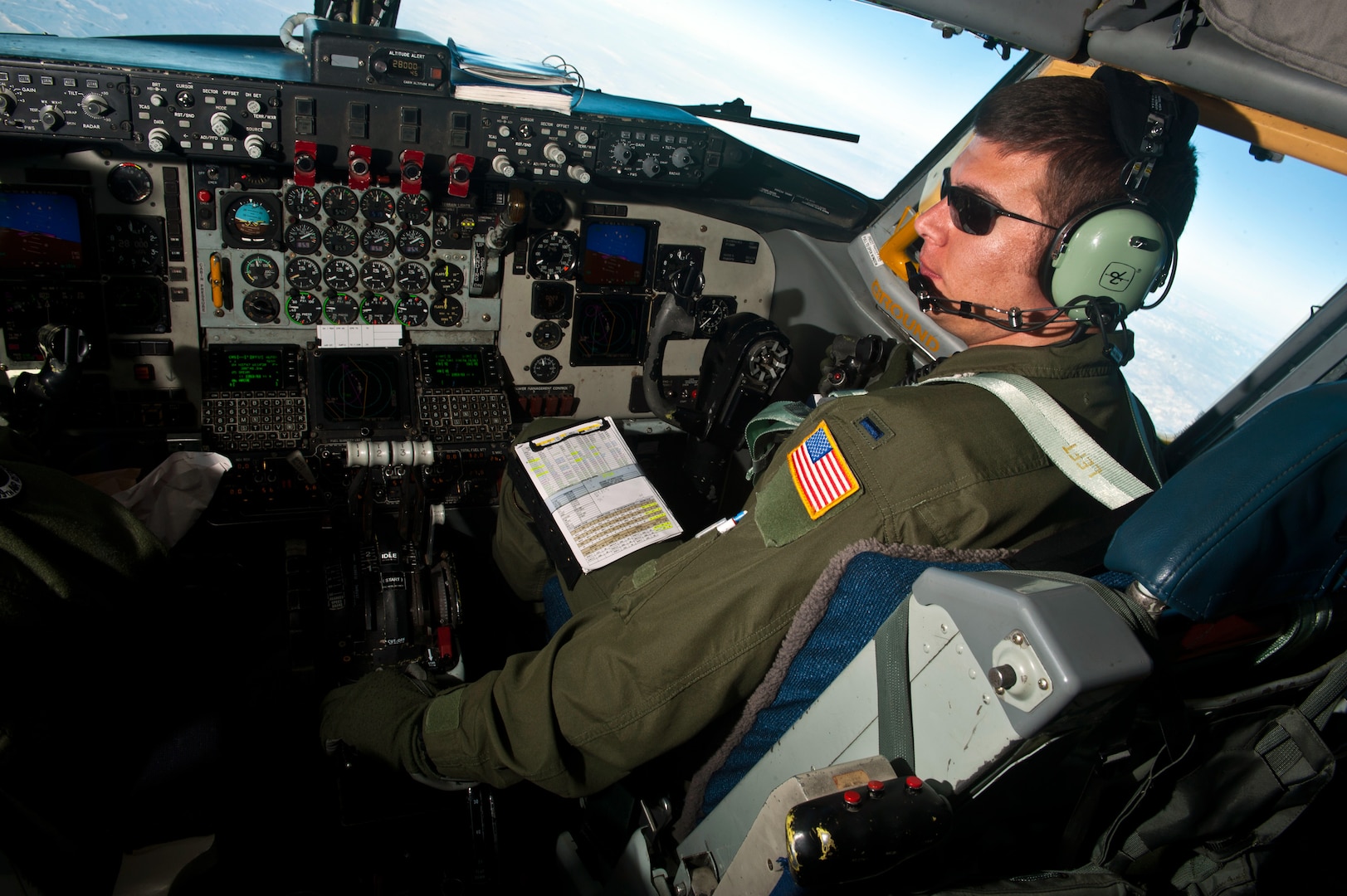 Air Force 1st Lt. John Fisher, a KC-135 Stratotanker pilot with the Alabama Air National Guard's 99th Air Refueling Squadron, communicates with aircraft arriving to refuel during Red Flag 12-3, March 9, 2012 at Nellis Air Force Base, Nev. Red Flag is a realistic air-to-air combat training exercise involving the air forces of the United States and its allies.
