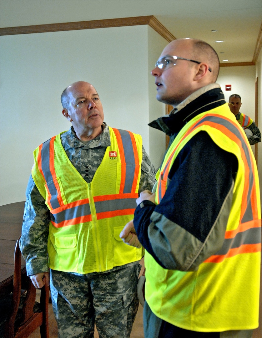 Army Lt. Gen. William Ingram Jr., director of the Army National Guard, left, gets a tour of the future home of Army family housing on Camp Humphreys, Republic of Korea, given by David Talbot.
