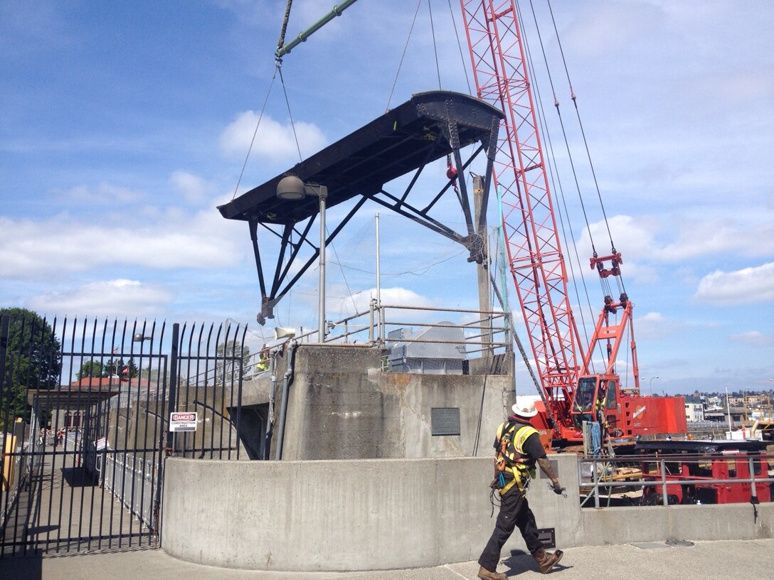 Redside Construction is removing a tainter gate at the Hiram M. Chittenden Locks in Ballard, Wash., this week. A tainter gate is a type of radial arm floodgate used in dams and canal locks to control water flow, named for Wisconsin structural engineer Jeremiah Burnham Tainter.