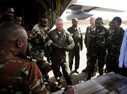 Chief Master Sgt. Bill Wunderlin 130th Rescue Wing loadmaster, demonstrates how to hook up a winch during a joint exercise in Dakar, Senegal, June 19, 2014. 