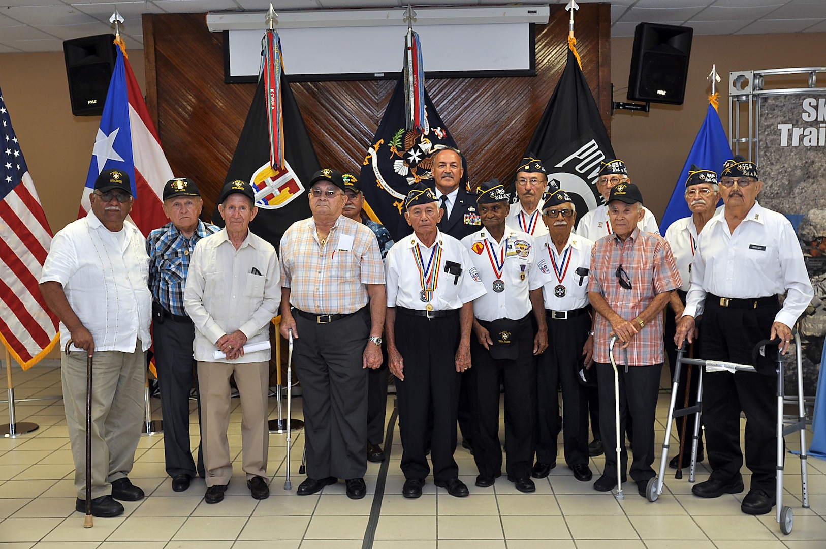 The adjutant general of Puerto Rico Brig. Gen. Juan J. Medina Lamela, with a group of veteran Borinqueneers of the 65th Infantry Regiment at the roundtable The Borinqueneers: Then and Now: The Evolution of the 65th Infantry Regiment in San Juan on June 24, 2014.