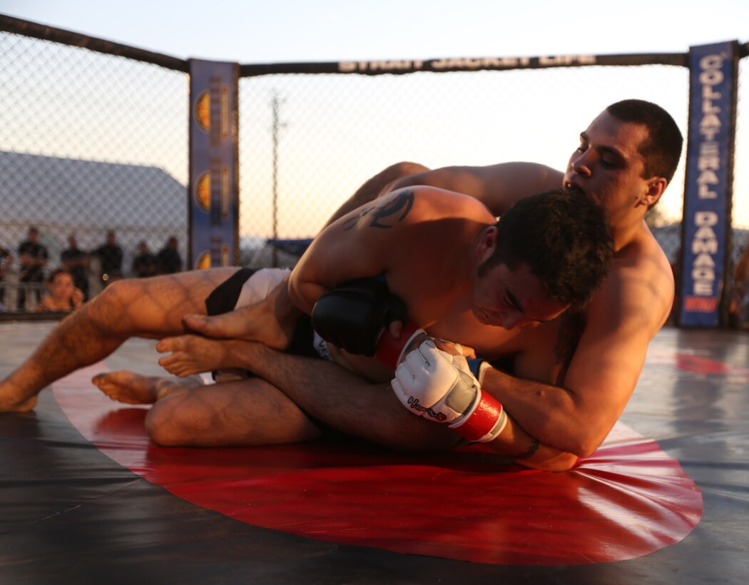 Antonio Zuazo, fighter, P5 Academy, grapples Nic Wang, fighter, Hand 2 Hand MMA, during Summer Fight Night V at Del Valle Field, June 20, 2014. Summer Fight Night V featured 24 fighters in 12 matches.
