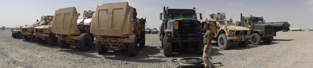 Courtesy photo - A Marine with Logistics Command Forward inspects tactical vehicles during his deployment to Camp Leatherneck, Helmand province, Afghanistan. LOGCOM Forward was responsible for redeploying tactical vehicles and gear to Marine Corps Logistics Base Albany, Ga., for reset and reconstitution as deployed units begin to redeploy home, prior to their flag-folding ceremony, June 1, 2014.