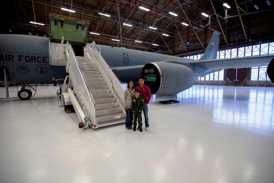 Sam Diaz, his mother, Allison, and his father, Julio, stand in front of a KC-135 Stratotanker for a picture during pilot for a day at Fairchild Air Force Base, Washington, June 18, 2014. Sam was participating in the 141st Air Refueling Wing program which allows children going through challenging times to become an honorary wing pilot. (U.S. Air Force photo/Tech. Sgt. Michael Brown)