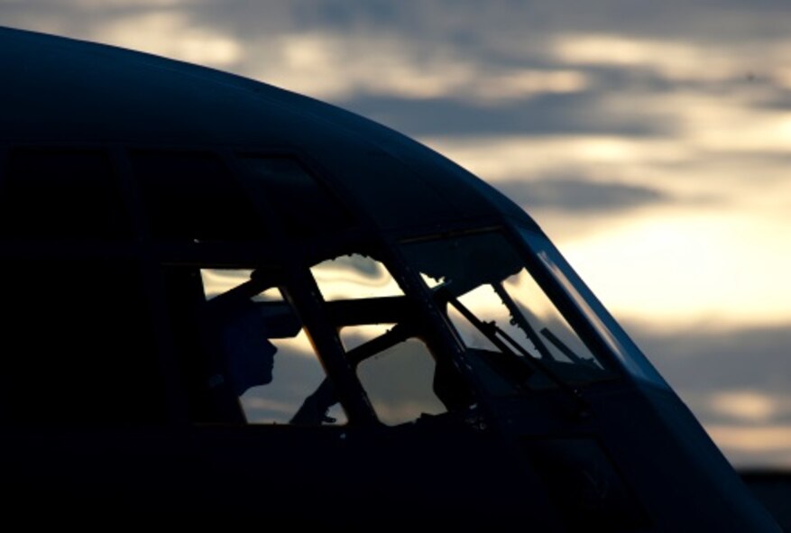 A U. S Air Force crew chief from the 317th Aircraft Maintenance Squadron inspects the cockpit of a C-130J Super Hercules June 21, 2014, at Dyess Air Force Base, Texas. More than 500 manning hours and 200 maintainers generated 12 aircraft in preparation for the large-scale launch. (U.S. Air Force photo by Senior Airman Peter Thompson/Released)

