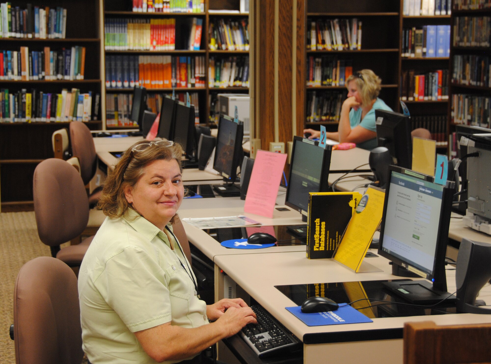 VANCE AIR FORCE BASE, Okla. – Antonietta Pellegrino, a librarian at the Vance AFB Library, logs onto a social media Website June 25 at the Base Library. The hours for the library have been reduced. The library is now open Monday through Thursday, 11 a.m. to 6:30 p.m.; Friday and Saturday, noon to 5 p.m.; and closed Sunday. (U.S. Air Force photo/2nd Lt. Mark Habermeyer)