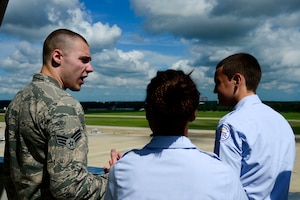 U.S. Air Force Senior Airman Joshua Shaffer, 1st Operations Support Squadron air traffic controller, teaches Air Force Junior ROTC cadets about his job responsibilities during Shadow Day at Langley Air Force Base, Va., June 24, 2014. Eighty cadets from five local high schools visited various units at Langley to learn about the Air Force mission. (U.S. Air Force photo by Senior Airman Kayla Newman/Released)