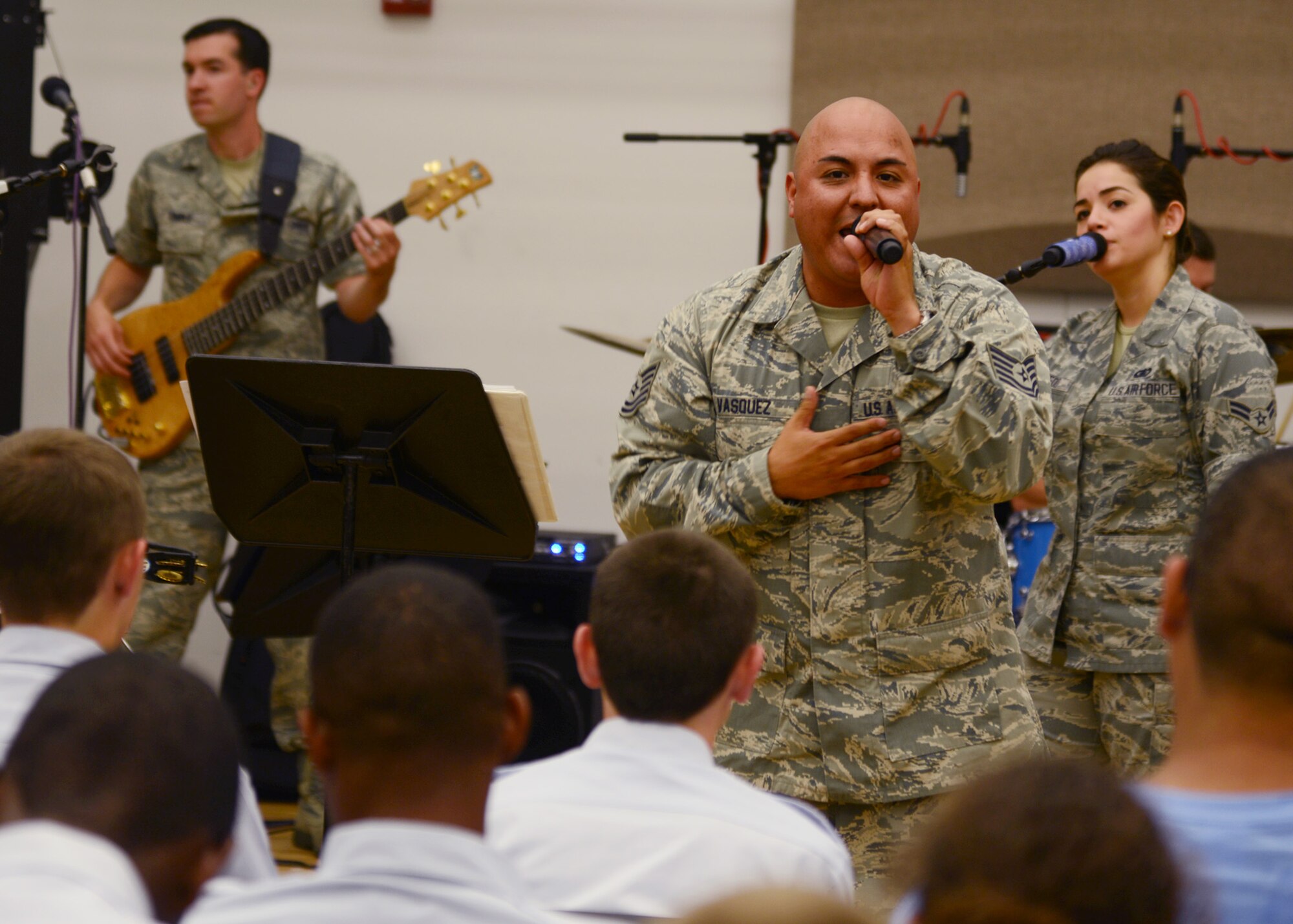 U.S. Air Force Tech. Sgt. Richard Vasquez, Air Force Heritage of America Band vocalist, performs with the band’s “Full Spectrum” ensemble for Air Force Junior ROTC cadets at Crawford Hall during the annual Shadow Day at Langley Air Force Base, Va., June 24, 2014. The Heritage of America Band capped off shadow day for cadets, who spent the morning in small groups visiting Airmen from various career fields at work centers across the installation. (U.S. Air Force photo by Senior Airman Jason J. Brown/Released)