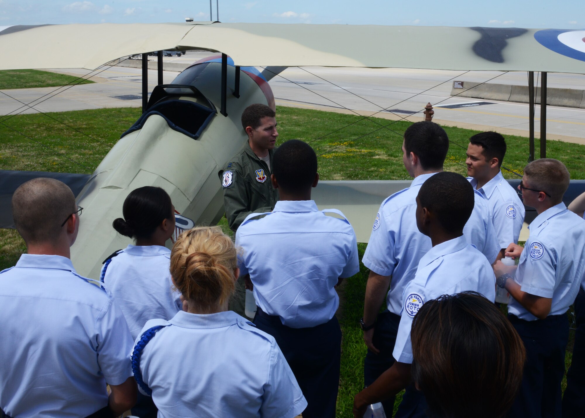 U.S. Air Force Capt. Dan Naim, 94th Fighter Squadron E Flight commander, explains the principles of flight to Air Force Junior ROTC cadets during the annual Shadow Day at Langley Air Force Base, Va., June 24, 2014. Naim used the squadron’s historic Nieuport 28 aircraft display to tie the dynamics of flight to the unit’s illustrious history as one of the Air Force’s oldest flying squadrons. (U.S. Air Force photo by Senior Airman Jason J. Brown/Released)