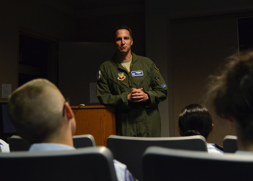 U.S. Air Force Lt. Col. Jeff Hawkins, 94th Fighter Squadron commander, speaks to Air Force Junior ROTC cadets about life as an Air Force pilot during the annual Shadow Day at Langley Air Force Base, Va., June 24, 2014. Hawkins and his team of pilots and maintainers showed cadets the progression of flying operations from aircraft maintenance through take-off, and provided advice to cadets interested in becoming pilots. (U.S. Air Force photo by Senior Airman Jason J. Brown/Released)