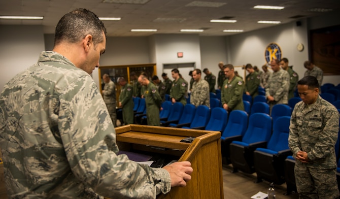 U.S. Air Force Capt. Jeremiah Blackburn, a chaplain for the 23d Wing Chapel, says a prayer during a Khobar Towers Remembrance ceremony at Moody Air Force Base, Ga., June 25, 2014. The ceremony honored the 19 U.S. service members and one Saudi who died along with 350 others who were wounded. (U.S. Air Force photo by Senior Airman Douglas Ellis/Released)
