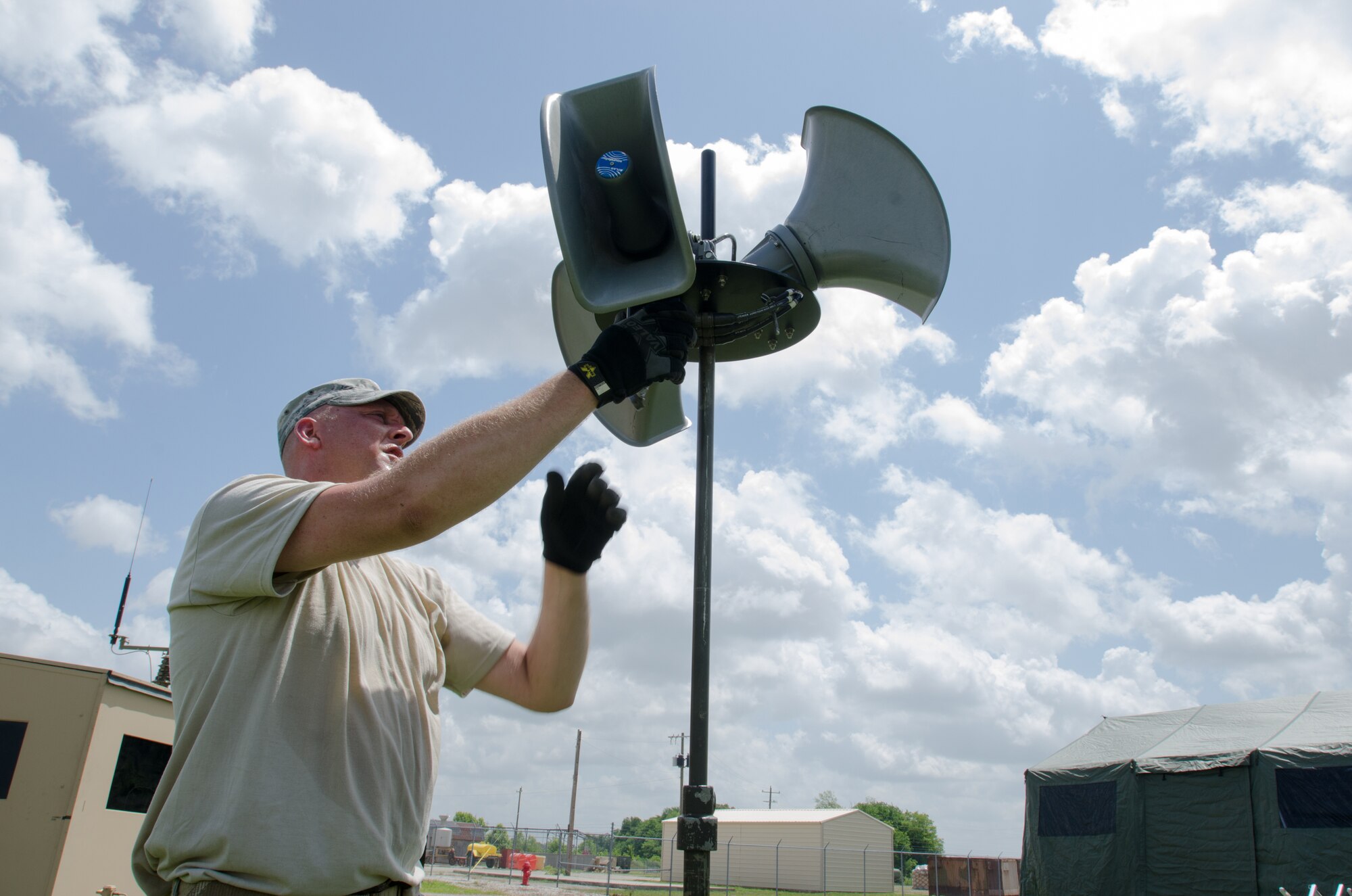 Master Sgt. Kyle Goins, a communications specialist for the Kentucky Air National Guard’s 123rd Contingency Response Group, sets up a “big voice” system at Fort Campbell, Ky., June 17, 2014, during Capstone '14, a homeland earthquake-response exercise. The 123rd CRG joined forces with the U.S. Army’s 688th Rapid Port Opening Element to operate a Joint Task Force-Port Opening here from June 16 to 19, 2014. (U.S. Air National Guard photo by Master Sgt. Phil Speck)