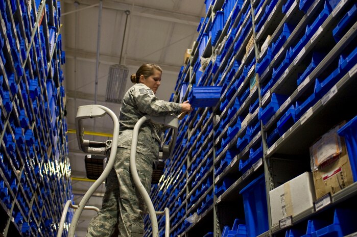 Tech. Sgt. Tamara Wass, 419th Logistics Readiness Squadron, Hill Air Force Base, Utah supply craftsman, gets items from a supply shelf June 20, 2014 at Nellis AFB, Nev. Wass, a reservist stationed unit was here for her annual two week training.  (U.S. Air Force photo by Monet Villacorte)