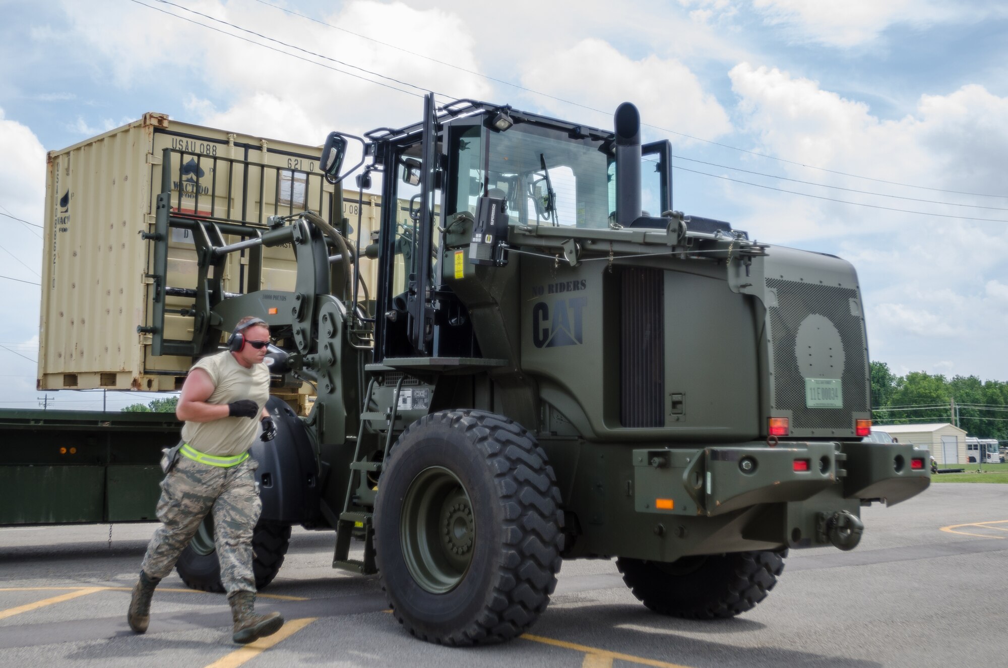Airmen from the Kentucky Air National Guard’s 123rd Contingency Response Group use a forklift to load cargo onto a flatbed truck during Capstone '14, a homeland earthquake-response exercise at Fort Campbell, Ky., on June 18, 2014. The 123rd CRG joined forces with the U.S. Army’s 688th Rapid Port Opening Element to operate a Joint Task Force-Port Opening here from June 16 to 19, 2014. (U.S. Air National Guard photo by Master Sgt. Phil Speck)