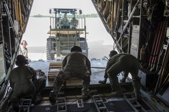 Airmen from the Kentucky Air National Guard’s 123rd Contingency Response Group offload cargo from a Kentucky Air Guard C-130 Hercules during Capstone '14, a homeland earthquake-response exercise at Fort Campbell, Ky., on June 18, 2014. The 123rd CRG joined forces with the U.S. Army’s 688th Rapid Port Opening Element to operate a Joint Task Force-Port Opening here from June 16 to 19, 2014. (U.S. Air National Guard photo by Master Sgt. Phil Speck)