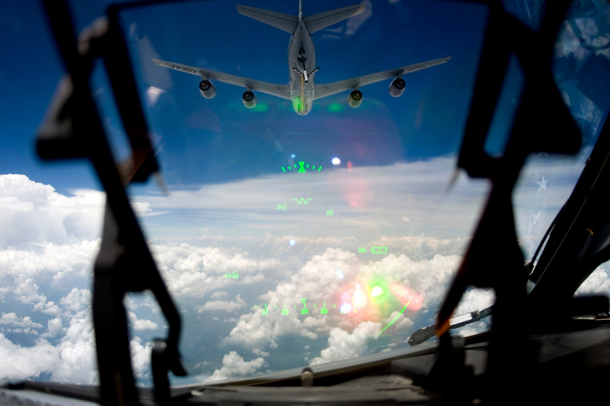 A 434th Air Refueling Wing KC-135R Stratotanker from Grissom Air Reserve Base, Ind., can be seen through a heads-up display of a C-17 Globemaster III from the 445th Airlift Wing at Wright-Patterson Air Force Base, Ohio, during a training mission June 18, 2014. The main mission of the KC-135 is to provide inflight refueling to long-range bomber, fighter and cargo aircraft. (U.S. Air Force photo/Tech. Sgt. Mark R. W. Orders-Woempner)