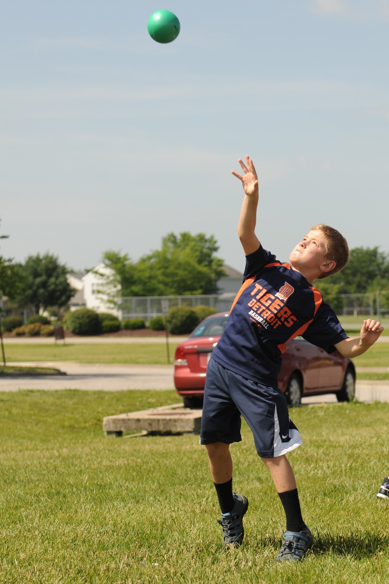 Alexis Rynders competes in shot put at the Youth Center during the 2014 Olympic Celebration at Scott Air Force Base, Ill., June 18, 2014.  Children participated in a variety of challenges including relay races and bean bag tosses.  During the closing ceremony, Ed Cockrell gave the children a motivational speech about the importance of sportsmanship and the Olympics.  Cockrell won a silver medal in shot put during the Athens Olympics in 2004.  (U.S. Air Force photo by Staff Sgt. Maria Bowman)