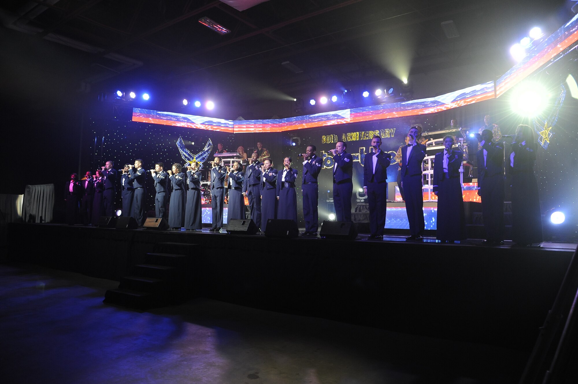 Tops In Blue members take the stage together during the final song of their performance at the Montana Expopark in Great Falls on June 23. After the show, TIB members greeted attendees and spoke about their experiences while on tour. (U.S. Air Force photo/Airman 1st Class Collin Schmidt)