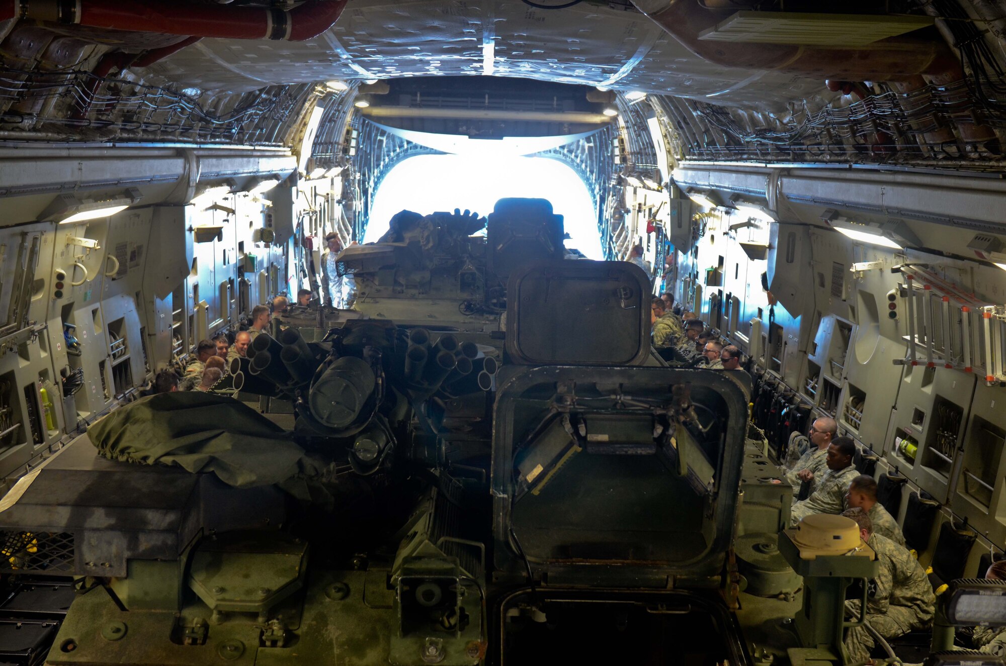 U.S. Army Soldiers with the 5th Battalion, 20th Infantry Regiment, 3-2 Stryker Brigade Combat Team, 7th Infantry Division, prepare a C-17 Globemaster III for takeoff during a training exercise June 19, 2014, at Joint Base Lewis-McChord, Wash. The training allowed Soldiers and Airmen to work together and practice loading and unloading Strykers. (U.S. Army photo/Staff Sgt. Justin Naylor)