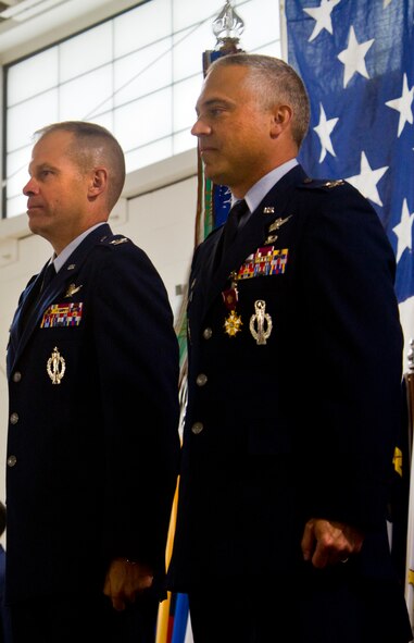 Col. Michael Lutton assumes command of the 91st Missile Wing from Col.
Robert Vercher during a change of command ceremony at Minot Air Force Base,
N.D., June 24, 2014. Lutton, who came from Offutt Air Force Base, Neb., is
the 91st MW's 52nd commander. (U.S. Air Force photo/Brittany Y. Bateman)
