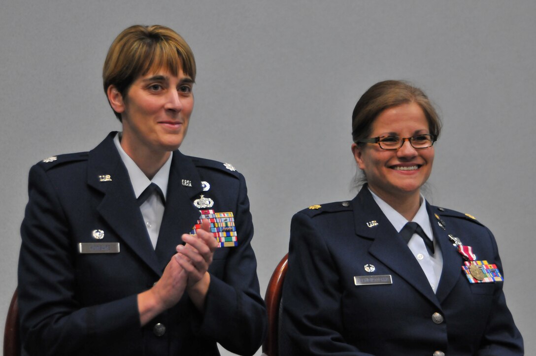 Maj. Graciela Scambiaterra, the operations officer for the 126th Force Support Squadron, attached to the 126th Air Refueling Wing, retires from the Illinois Air National Guard after 23 years of service at Scott Air Force Base Ill., June 8, 2014.  Lt. Col. Jennifer Howsare, commander of the 126 FSS, attached to the 126th Air Refueling Wing, provides a congratulatory round of applause during Scambiaterra's retirement ceremony. (Air National Guard photo by Staff Sgt. Andrew Kleiser)