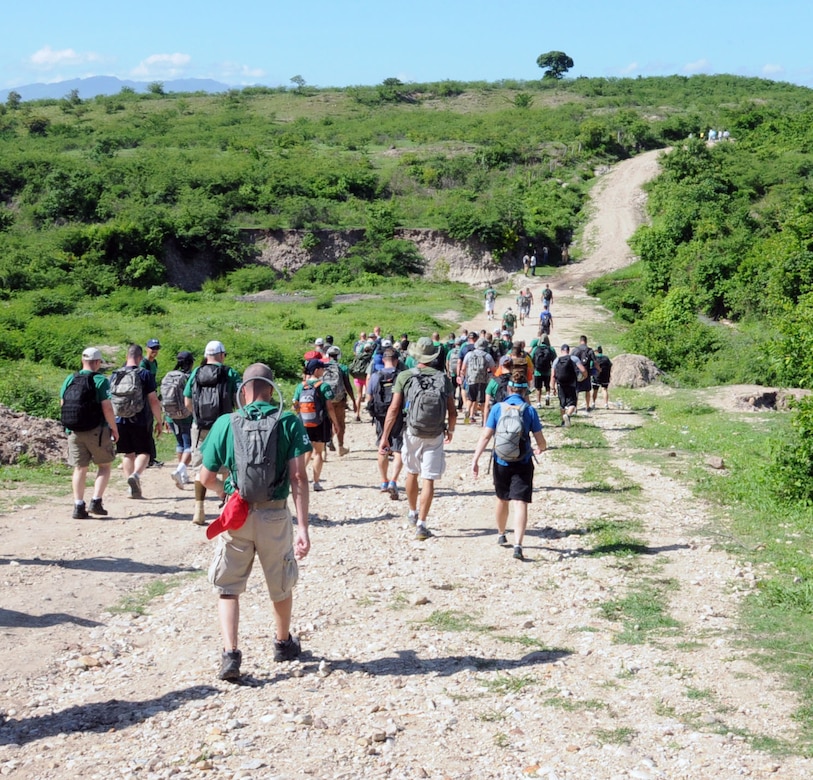 Nearly 130 members of Joint Task Force-Bravo, with the support of Joint Task Force-Bravo’s Joint Security Forces, completed a volunteer five mile round trip hike to deliver more than 4,000 pounds of food, supplies and clothing to families in need in the mountain village of Proterillos outside La Paz, Honduras, June 21, 2014.  The effort was part of the 55th Joint Task Force-Bravo Chapel Hike, a venerable tradition during which the servicemembers donate money to purchase food and supplies and then carry them on a hike through the mountains to deliver to local, underserviced communities.  (Photo by U. S. Air National Guard Capt. Steven Stubbs)