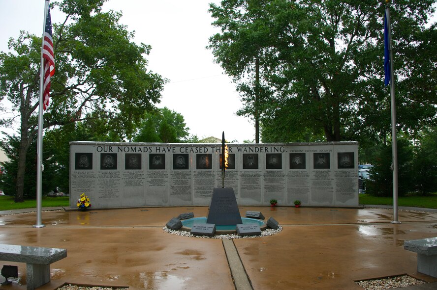 The flaming sword in front of the Khobar Towers Memorial Wall flickers as the 33rd Fighter Wing prepares for it's annual memorial ceremony June 25 at Eglin Air Force Base, Fla. The ceremony marks the 18th anniversary of the tragic bombing that killed 19 service members including 12 33rd FW Airmen. Due to inclement weather, the ceremony was moved indoors. (U.S. Air Force photo/Sara Vidoni)