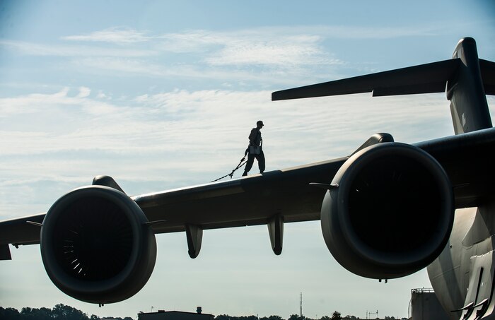 Airman 1st Class Matt Sinclair, 437th Aircraft Maintenance Squadron crew chief, inspects a Globemaster III C-17 wing, June 24, 2014, at Joint Base Charleston, S.C. The maintainers perform daily checks and maintenance to ensure the aircraft are ready to fly. (U.S. Air Force photo/Senior Airman George Goslin)