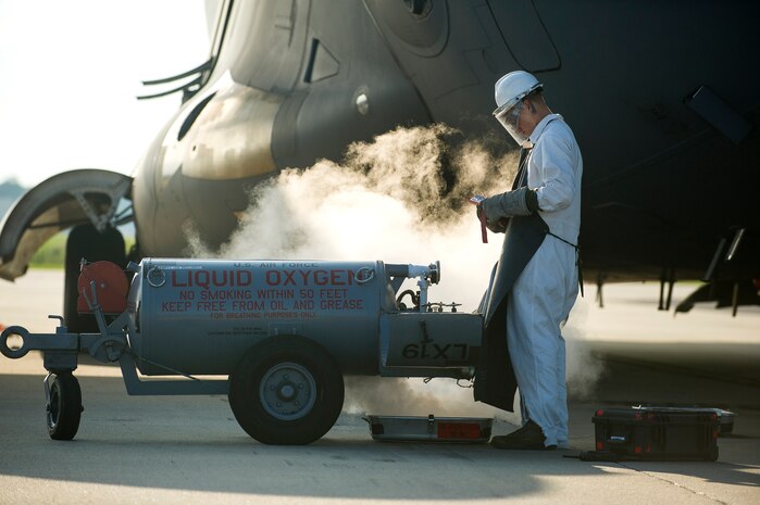 Airman 1st Class Dalton Rock, 437th Aircraft Maintenance Squadron crew chief, refills liquid oxygen on a Globemaster III C-17, June 24, 2014, at Joint Base Charleston, S.C. The maintainers perform daily checks and maintenance to ensure the aircraft are ready to fly. (U.S. Air Force photo/Senior Airman George Goslin)