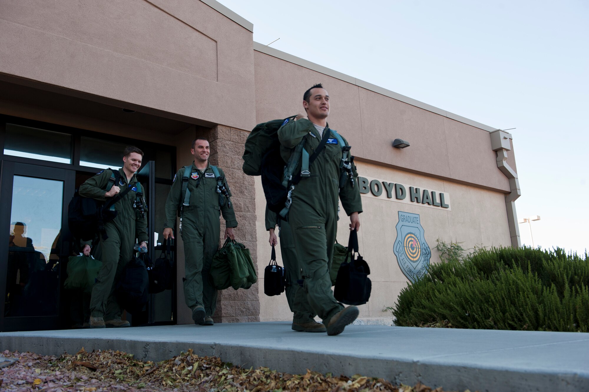 B-2 Spirit aircrew members from Whiteman Air Force Base, Mo. depart for their aircraft June 23, 2014, at Nellis AFB, Nev. Half of the pilots are active duty, and the other half are Air National Guard. These pilots are participating in total force integration which is designed to help AD, guard, and reserve units work effectively and efficiently with each other. (U.S. Air Force photo by Airman 1st Class Thomas Spangler) 