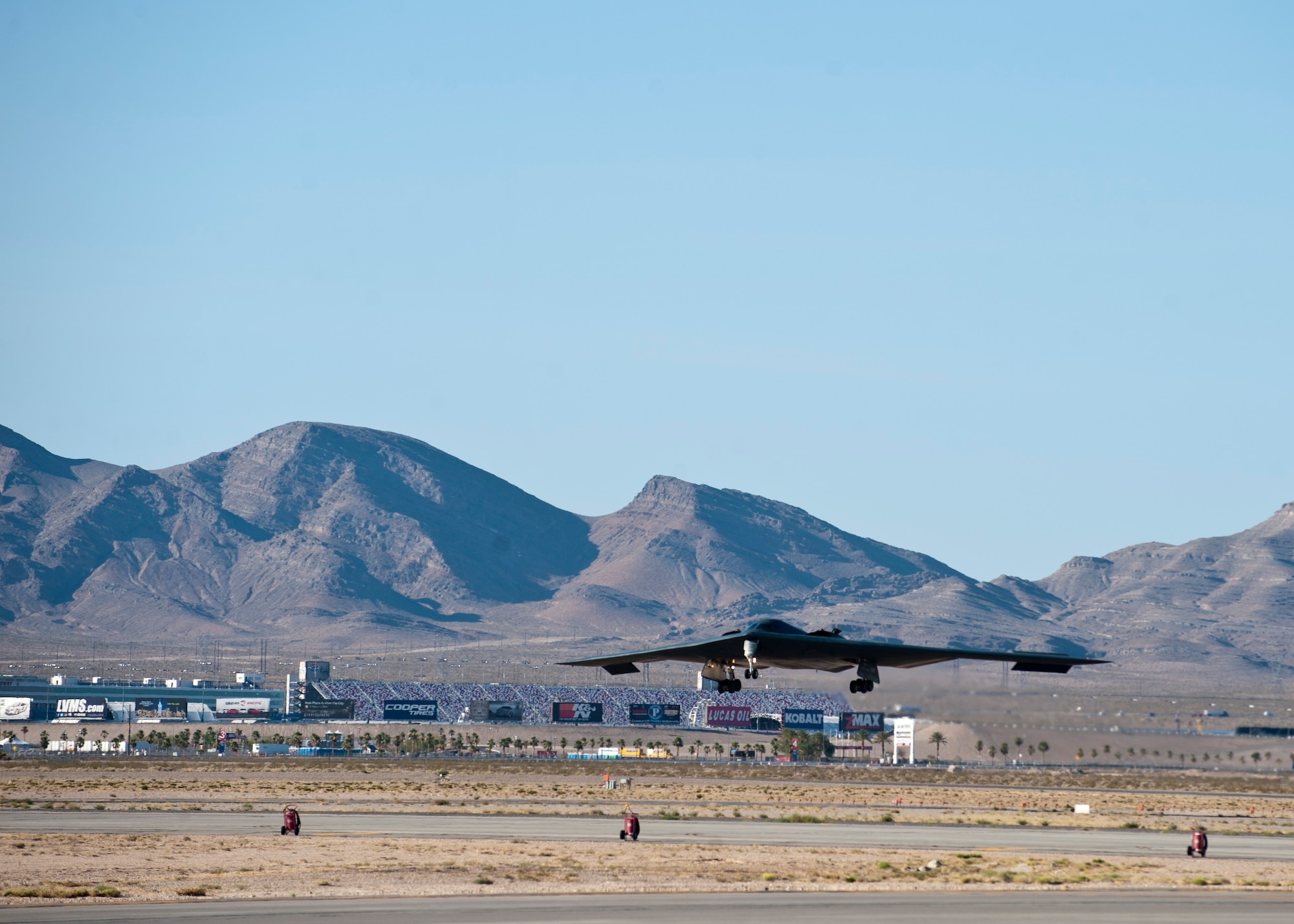 A U.S. Air Force B-2 Spirit assigned the 509th Bomb Wing from Whiteman Air Force Base, Mo. lands June 23, 2014, at Nellis AFB, Nev. The B-2 is a long-range stealth bomber capable of penetrating enemy defenses, can carry more than 40,000 pounds of both conventional and nuclear weapons, and fly approximately 6,000 nautical miles without refueling. (U.S. Air Force photo by Airman 1st Class Thomas Spangler) 