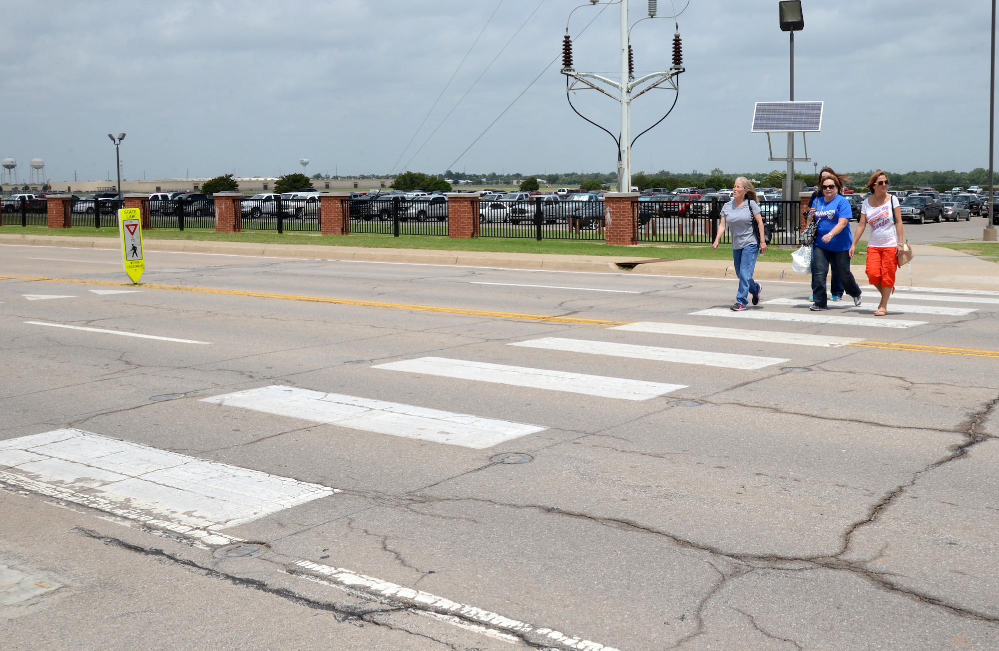 Many vehicle-pedestrian mishaps could be avoided if both the driver and the walker are paying attention. Pedestrians should always make eye contact with drivers before they enter the crosswalk. (Air Force photo by Kelly White)