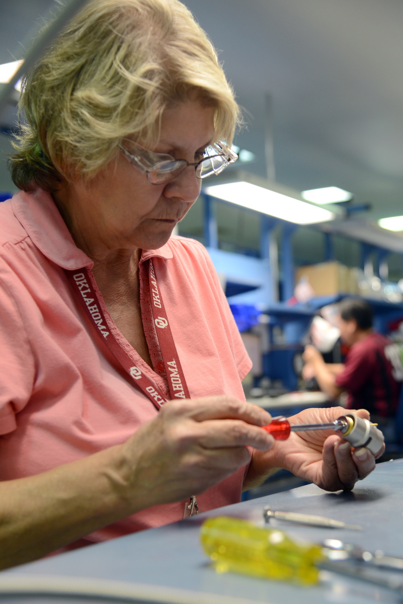 Like a complex puzzle, Cathy Ross, an instrument mechanic, assembles an 0393 oxygen regulator. This particular piece of equipment is made up of approximately 200 parts. (Air Force photo by Kelly White)
