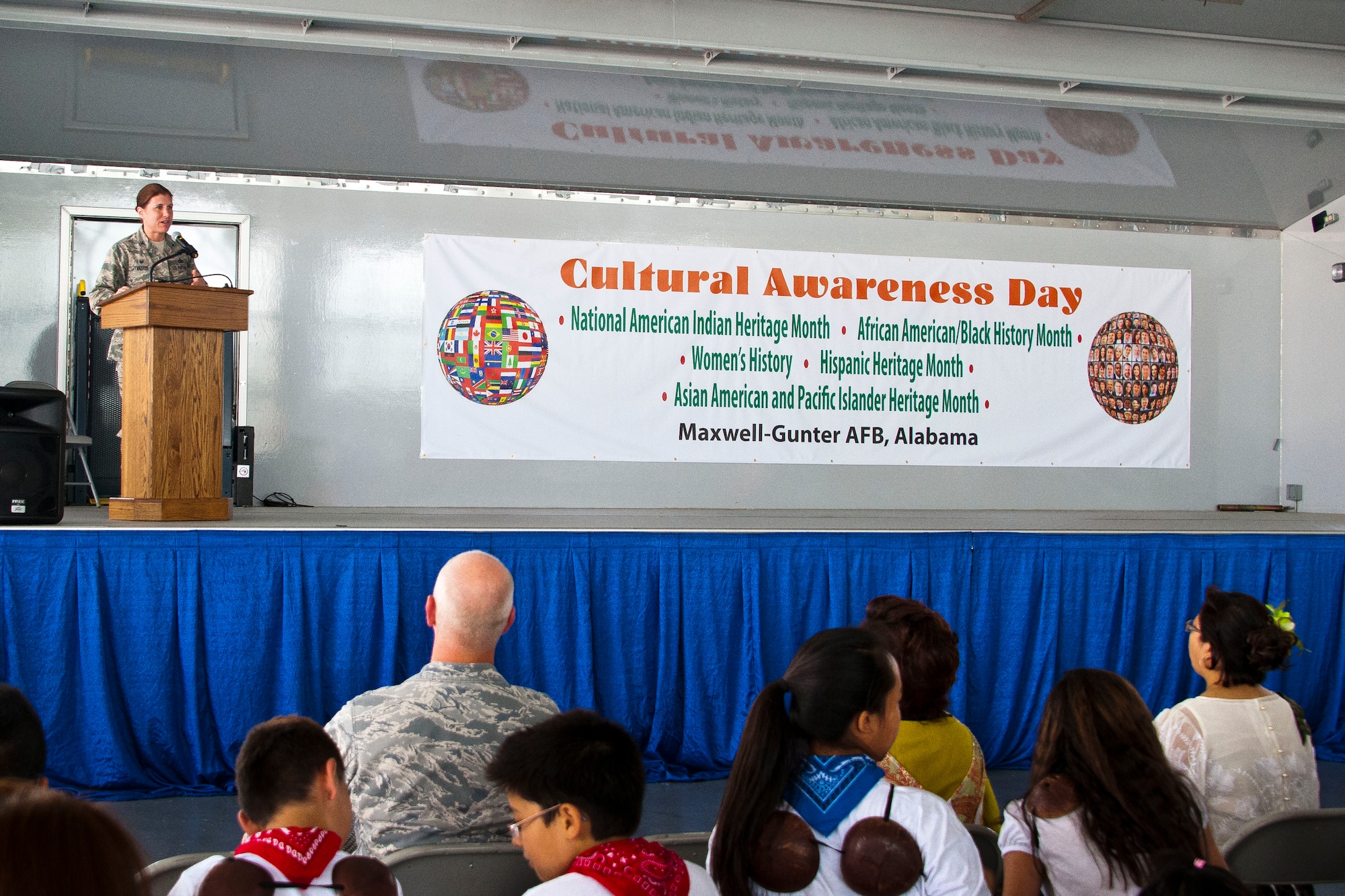 Col. Andrea Tullos, 42nd Air Base Wing commander, welcomes all participants to Maxwell Air Force Base’s Cultural Awareness Day June 20, 2014.  Various booths with information and food were setup to help educate the base about all the different cultures around the world. This was the first time Maxwell celebrated various cultures usually celebrated throughout the year in one day. (U.S. Air Force photo by Donna L. Burnett)

