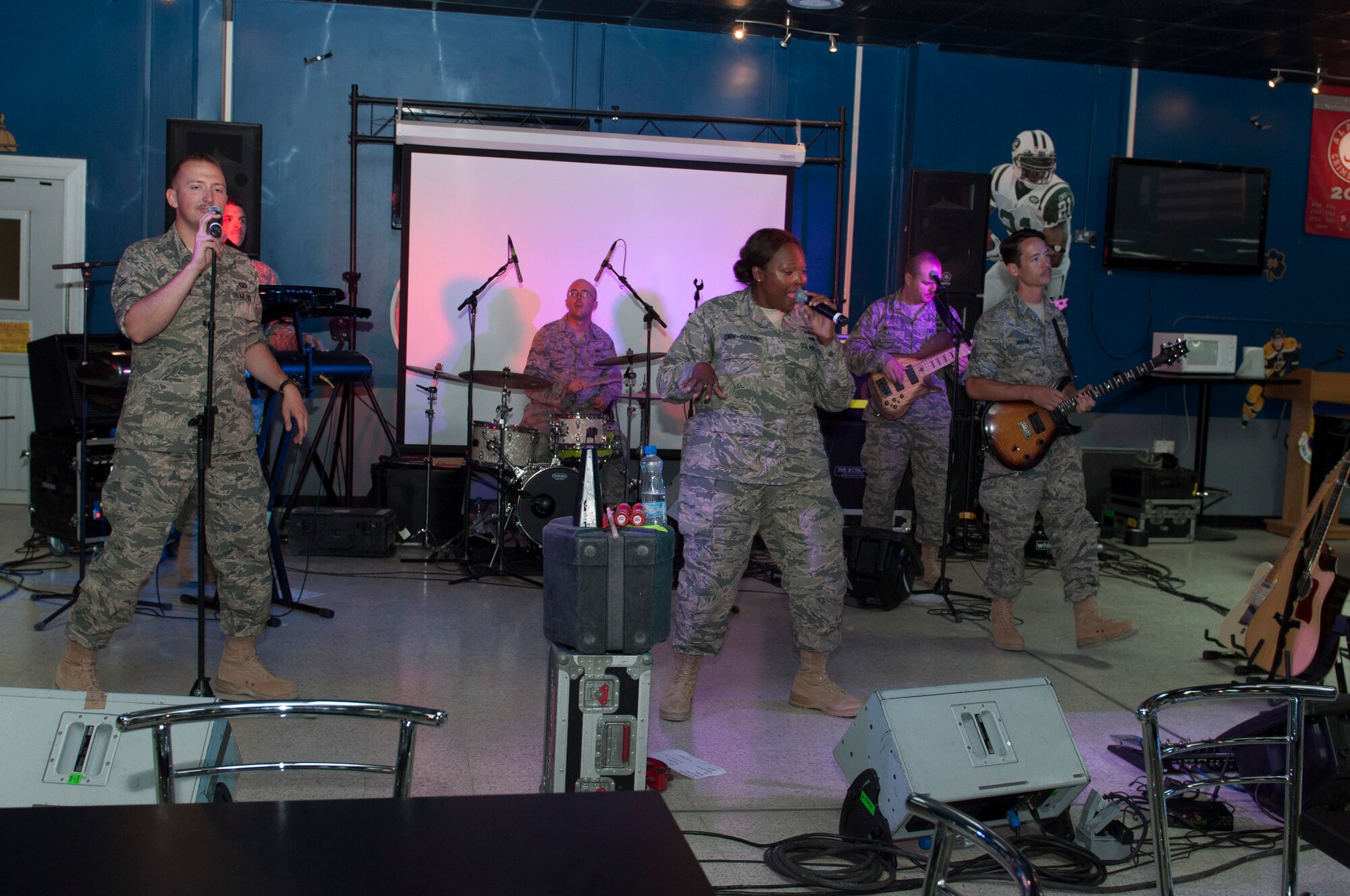 The United States Air Forces Central Band, Starlifter, performs for troops at The Rock June 17, 2014. Starlifter is a seven-member group of talented musicians that performs in virtually every musical idiom and was here in support of Operation Enduring Freedom. (U.S. Air Force photo by Senior Master Sgt. Allison Day)