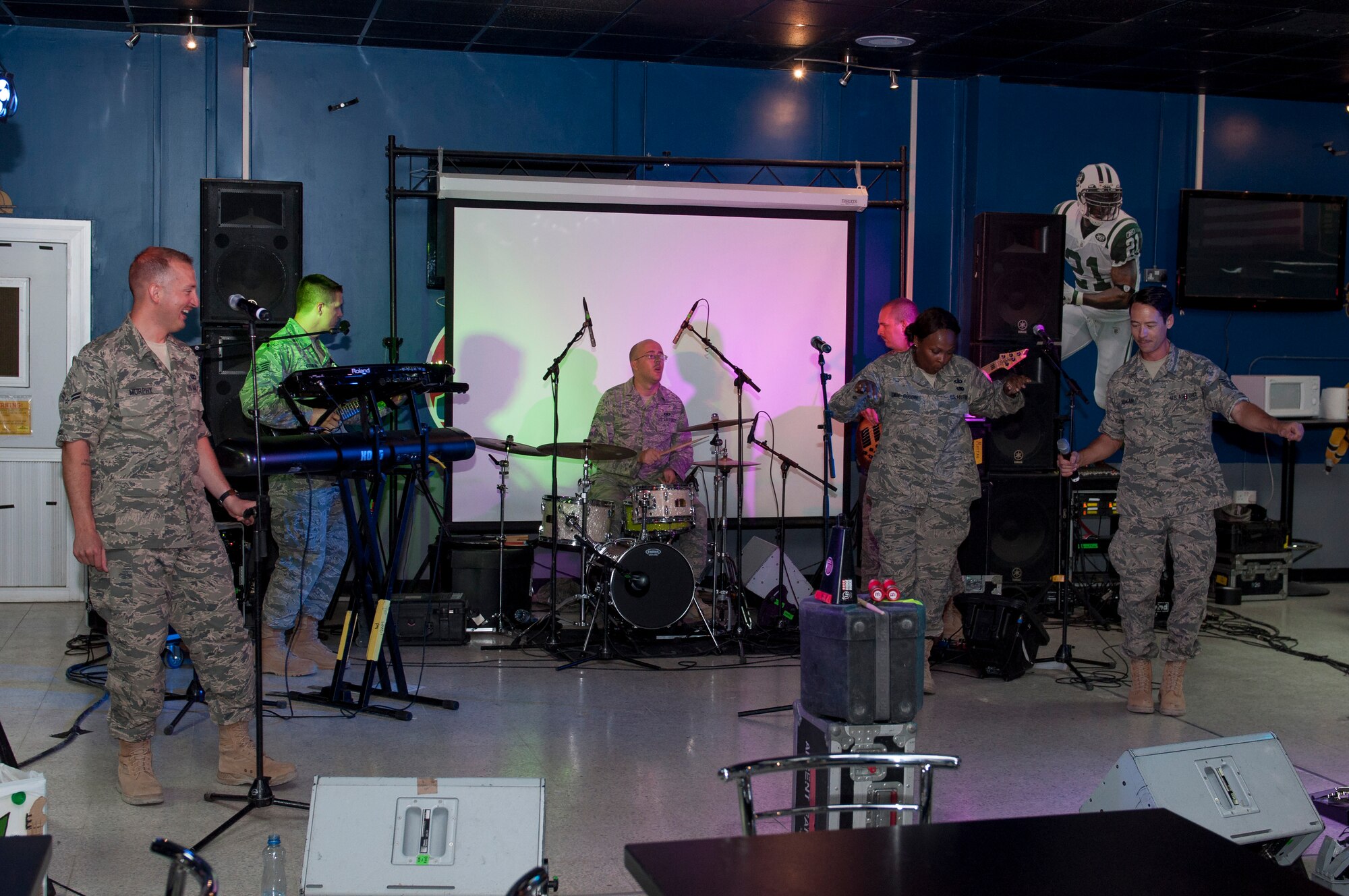 Members of the Air Forces Central band, Starlifter, perform at the Drop Zone at The Rock, June 17, 2014.  Starlifter is a seven-member group of talented musicians that performs in virtually every musical idiom and was here in support of Operation Enduring Freedom. (U.S. Air Force photo by Senior Master Sgt. Allison Day)