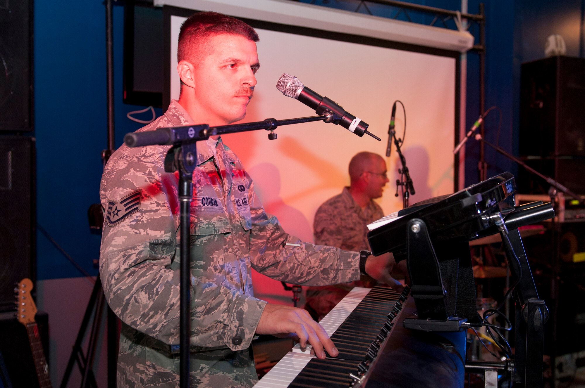 Staff Sgt. Chip Cothran, pianist and music director and Senior Airman JonMarc Dale,  Starlifter Drummer, play at the Drop Zone at The Rock June 17, 2014.  The band was here in support of Operation Enduring Freedom. (U.S. Air Force photo by Senior Master Sgt. Allison Day)