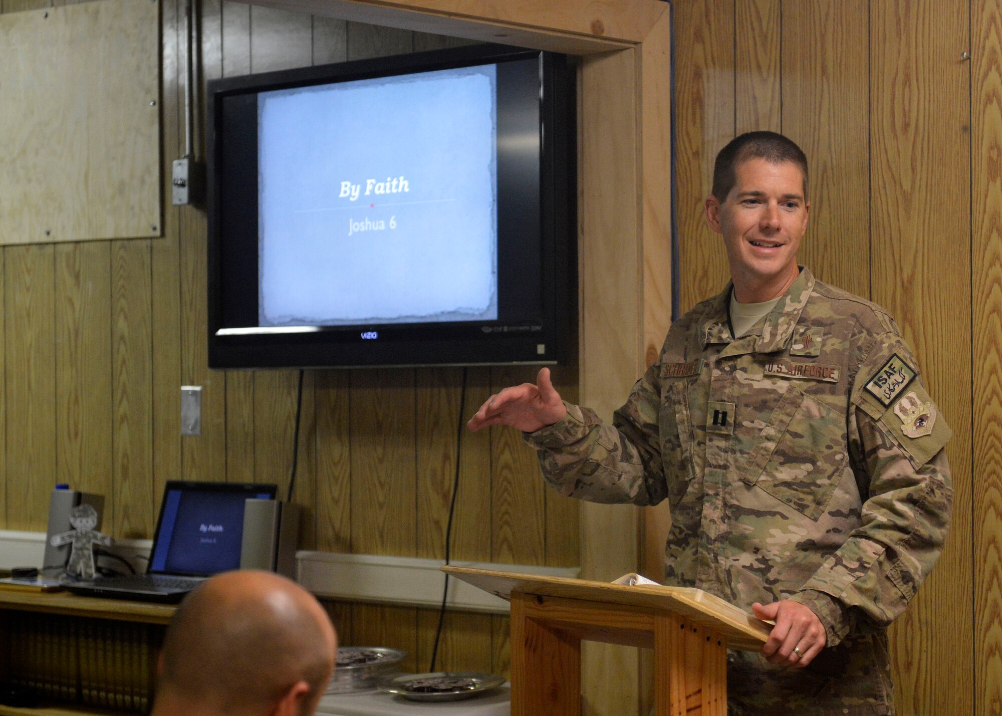 U.S. Air Force Chaplain (Capt.) Lance Schrader, 455th Maintenance Group Chaplain speaks with Airmen during a service at Bagram Airfield, Afghanistan June 22, 2014.  As the MXG Chaplain, Schrader’s priority is to take care of Airmen and ensure they are spiritually resilient.  Schrader is deployed from Mountain Home Air Force Base, Idaho and is a native of Lincoln, Neb.  (U.S. Air Force photo by Staff Sgt. Evelyn Chavez/Released)