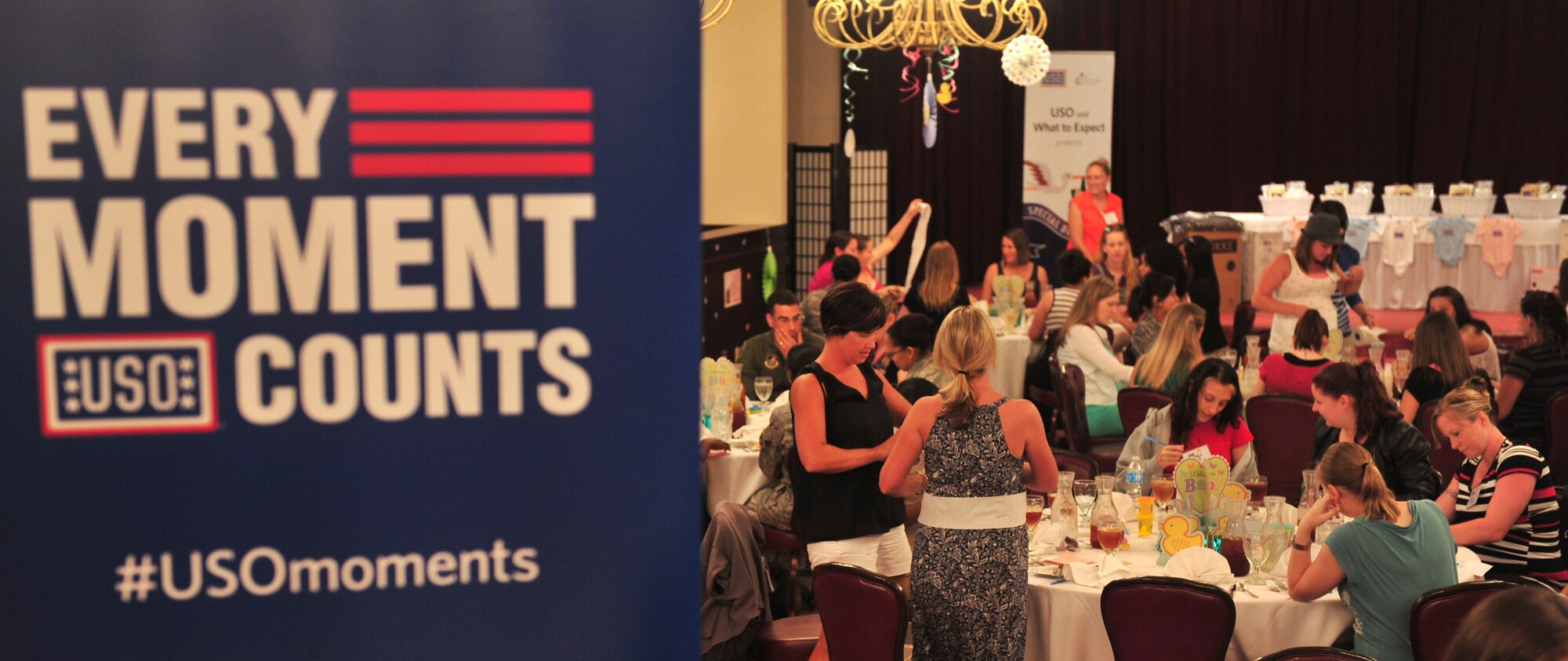 More than one hundred expectant military moms in Okinawa, including wives of servicemen and active duty service women, were treated to a baby shower celebration, hosted by the USO, author Heidi Murkoff and the What to Expect Foundation, Kadena Air Base, Japan, June 18, 2014. Three showers were held during the week in an effort to ensure the expectant mothers didn't miss the opportunity to celebrate the upcoming birth of their child because they are at an overseas assignment. (U.S. Air Force photo by Staff Sgt. Rachelle Coleman)