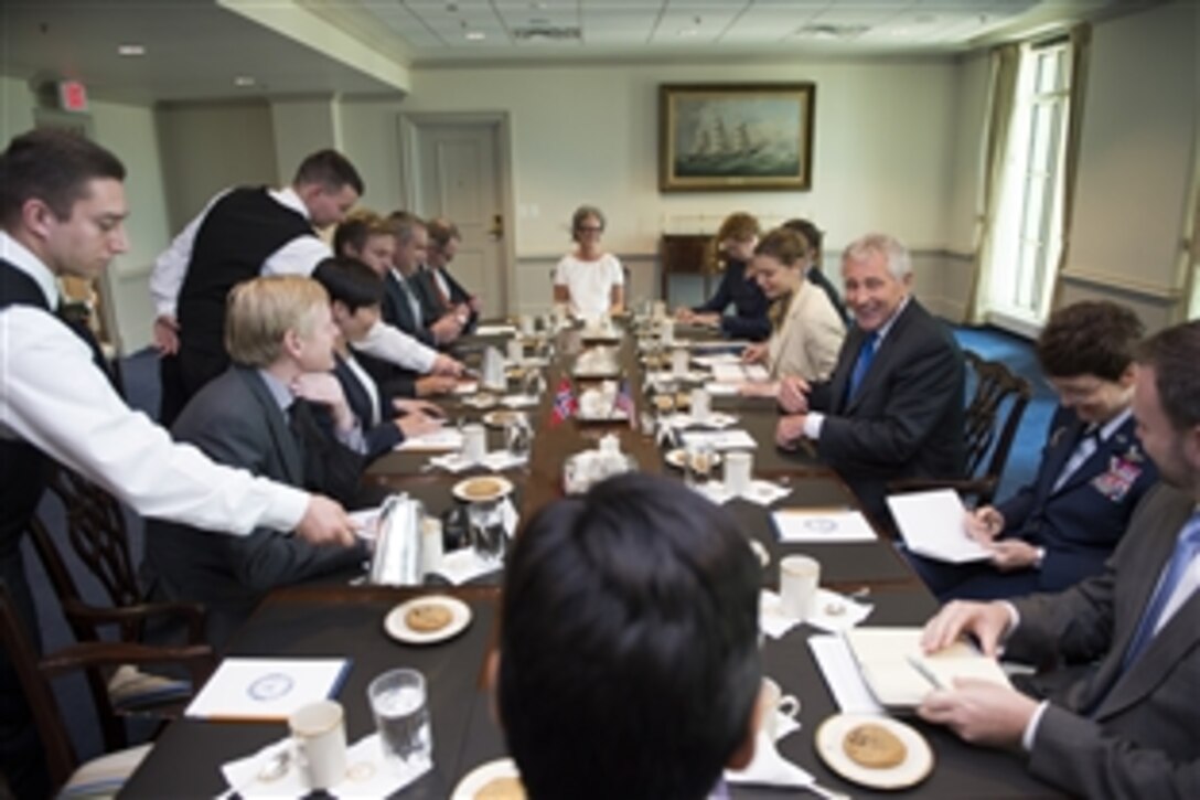 U.S. Defense Secretary Chuck Hagel, third from right, meets with Norwegian Defense Minister Ine Marie Eriksen Soreide, second from left, at the Pentagon, June 25, 2014. The two defense leaders met to discuss issues of mutual importance.