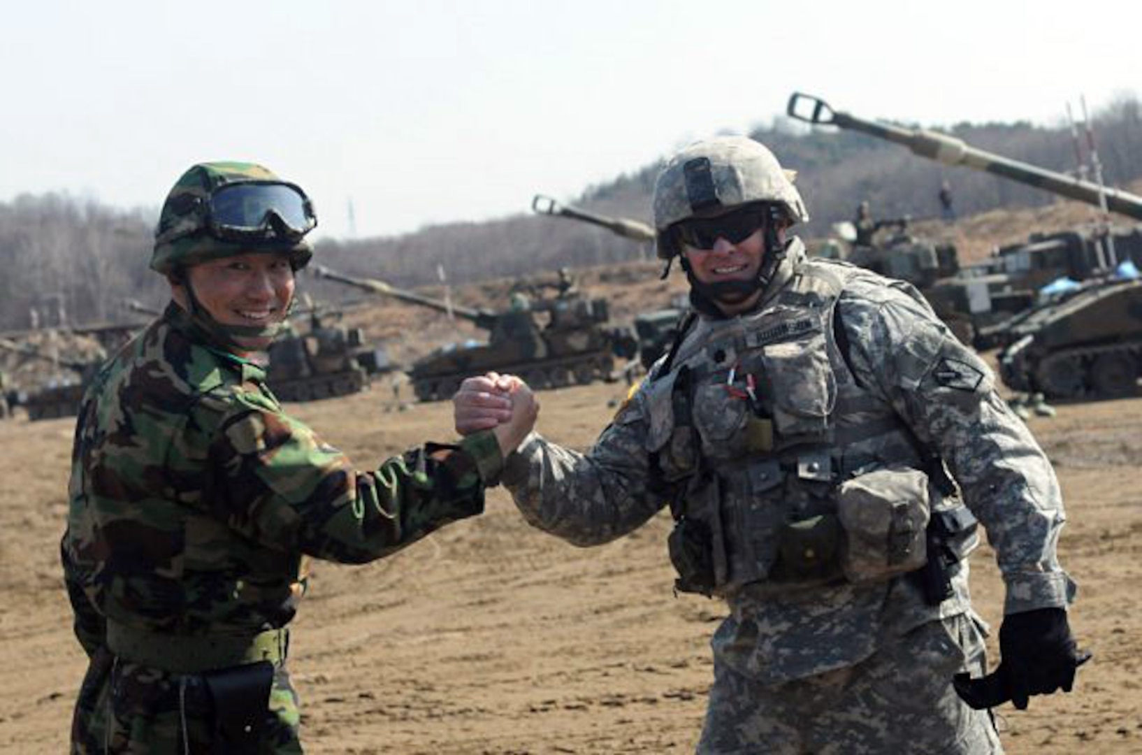 Members of the Utah National Guard's 145th Artillery Battalion, and the Republic of Korea Army's 628th Artillery Battalion, show the level of mutual respect they have for one another during an artillery live-fire exercise at the Rodriguez Live-Fire Complex in South Korea, March 15, 2012.