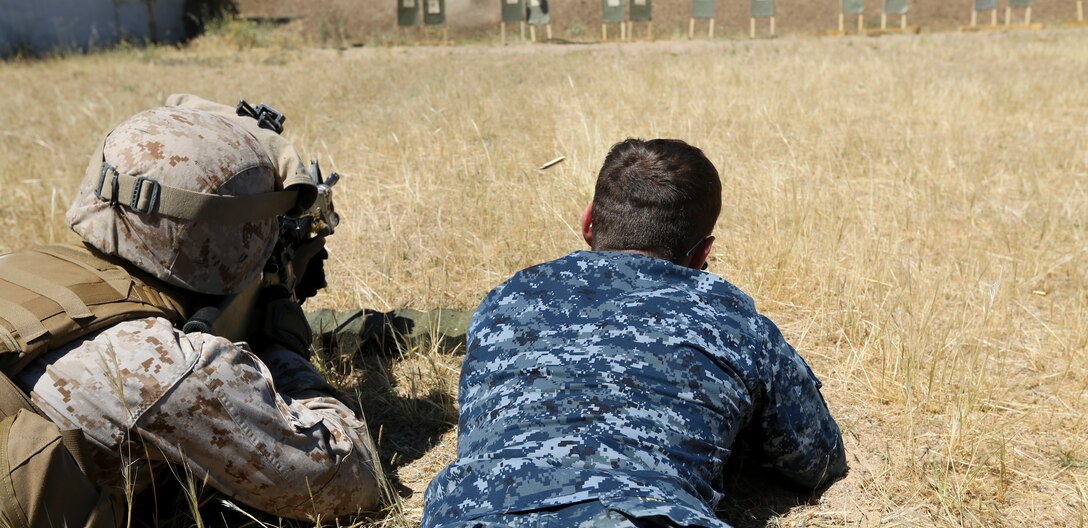 U.S. Naval Academy Midshipman Zachary Gawboy, a native of Maple Grove, Minnesota, fires the M4 service rifle during rifle and marksmanship training at Moron Air Base, May 26, 2014. The training was conducted during the midshipmen’s “professional cruise,” a program that allows future Naval Academy graduates to experience time in the Marine Corps.