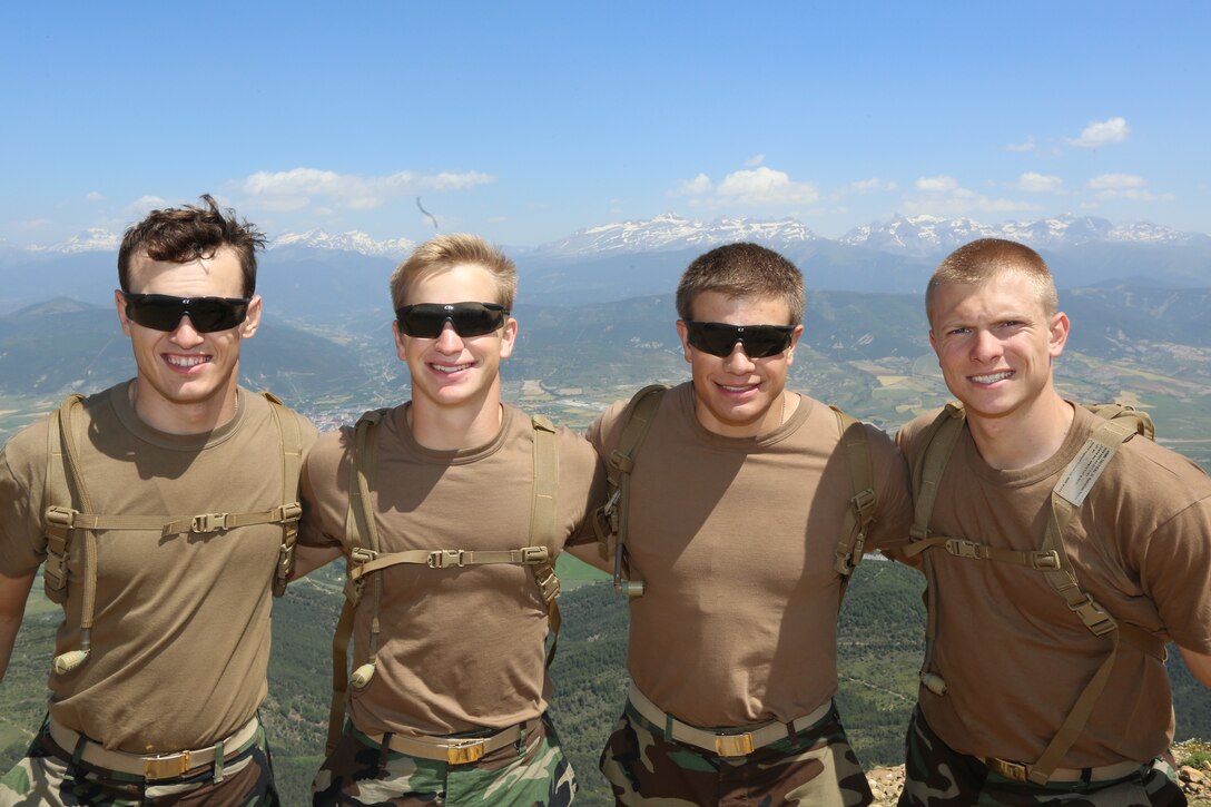 (From left to right) U.S. Naval Academy Midshipmen Ryan Lewandowski, Lukas Alland, Zachary Gawboy and Zachary Elsner stand on the summit of the Pyrenees mountain range during a bilateral training exercise with the Spanish Army at the Candachú Mountain Training Camp, Spain, June 8, 2014. The training was conducted during the midshipmen’s “professional cruise,” a program that allows future Naval Academy graduates to experience time in the Marine Corps. 