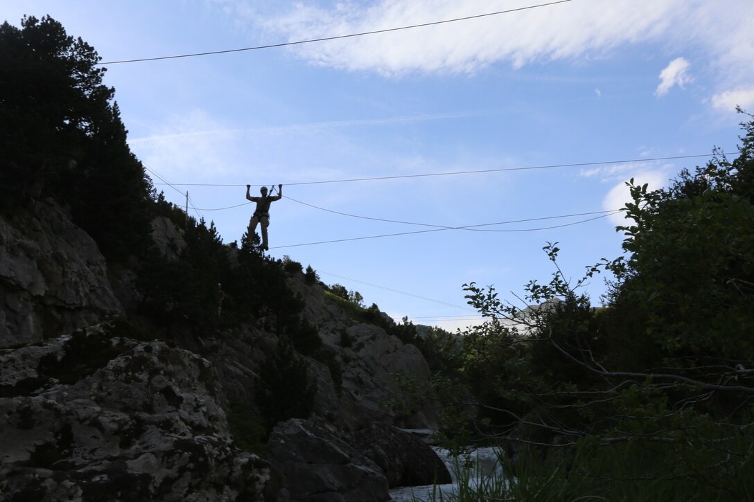 U.S. Naval Academy Midshipmen cross zip lines during a bilateral training exercise conducted between the U.S. Marines and the Spanish Army at the Candachú Mountain Training Camp, Spain, June 10, 2014. The training was conducted during the midshipmen’s “professional cruise,” a program that allows future Naval Academy graduates to experience time in the Marine Corps. 