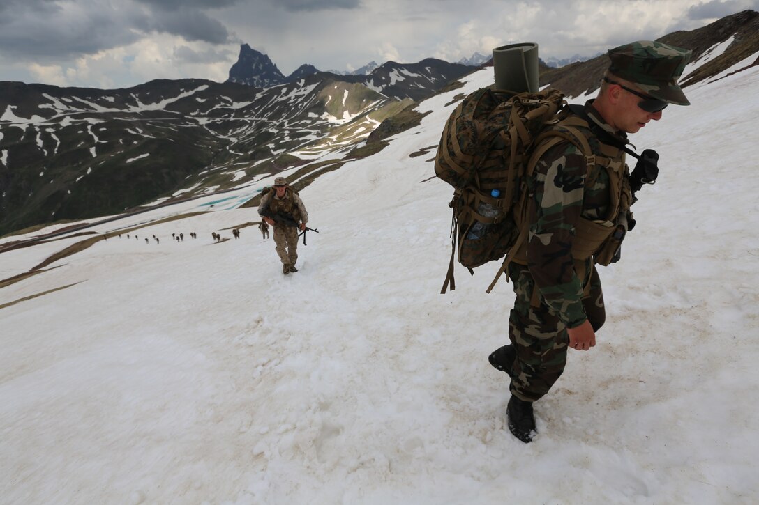 U.S. Naval Academy Midshipman Zachary Elsner, a native of Boone, Iowa, hikes the Pyrenees Mountains during a bilateral training exercise conducted between the U.S. Marines and the Spanish Army at the Candachú Mountain Training Camp, Spain, June 11, 2014. The training was conducted during the midshipmen’s “professional cruise,” a program that allows future Naval Academy graduates to experience time in the Marine Corps.
