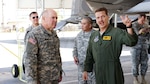 Air Force Lt. Col. Mark Ladtkow, pilot with the 199th Fighter Squadron, briefs Army Lt. Gen. William E. Ingram Jr., Army National Guard director, on the capabilities of Hawaii's Air Guards F-22 Raptor during a tour of National Guard Facilities in Hawaii.