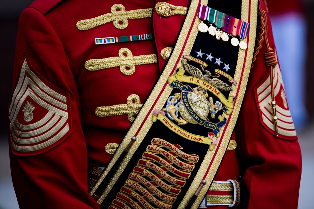 Master Gunnery Sgt. Kevin Buckles, U.S. Marine Drum & Bugle Corps drum major, stands at ease during a concert at Marine Barracks Washington, D.C., June 25, 2014. The concert was to honor the 80th anniversary of the Drum & Bugle Corps. (Official Marine Corps photo by Cpl. Dan Hosack/Released)