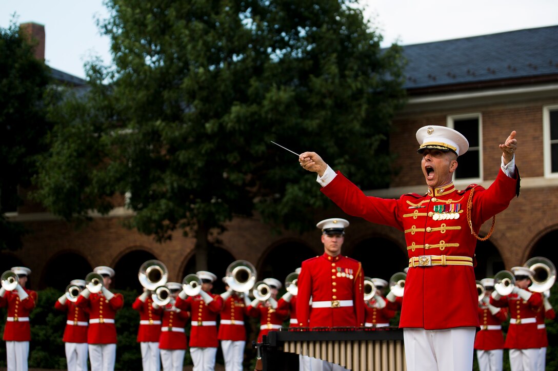 Maj. Brian Dix, U.S. Marine Drum & Bugle Corps commanding officer, performs during a concert at Marine Barracks Washington, D.C., June 25, 2014. The concert was to honor the 80th anniversary of the Drum & Bugle Corps. (Official Marine Corps photo by Cpl. Dan Hosack/Released)