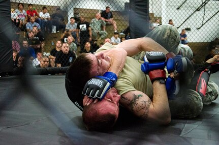 Army Spc. Miles McDonald, Missouri Army National Guard, won the 2012 National Guard Combatives Tournament 115-pound featherweight class with a rear chokehold submission against Army Sgt. Terry Hams, Alaska Army National Guard March 19, 2012. Team Missouri placed second overall with 281 points.