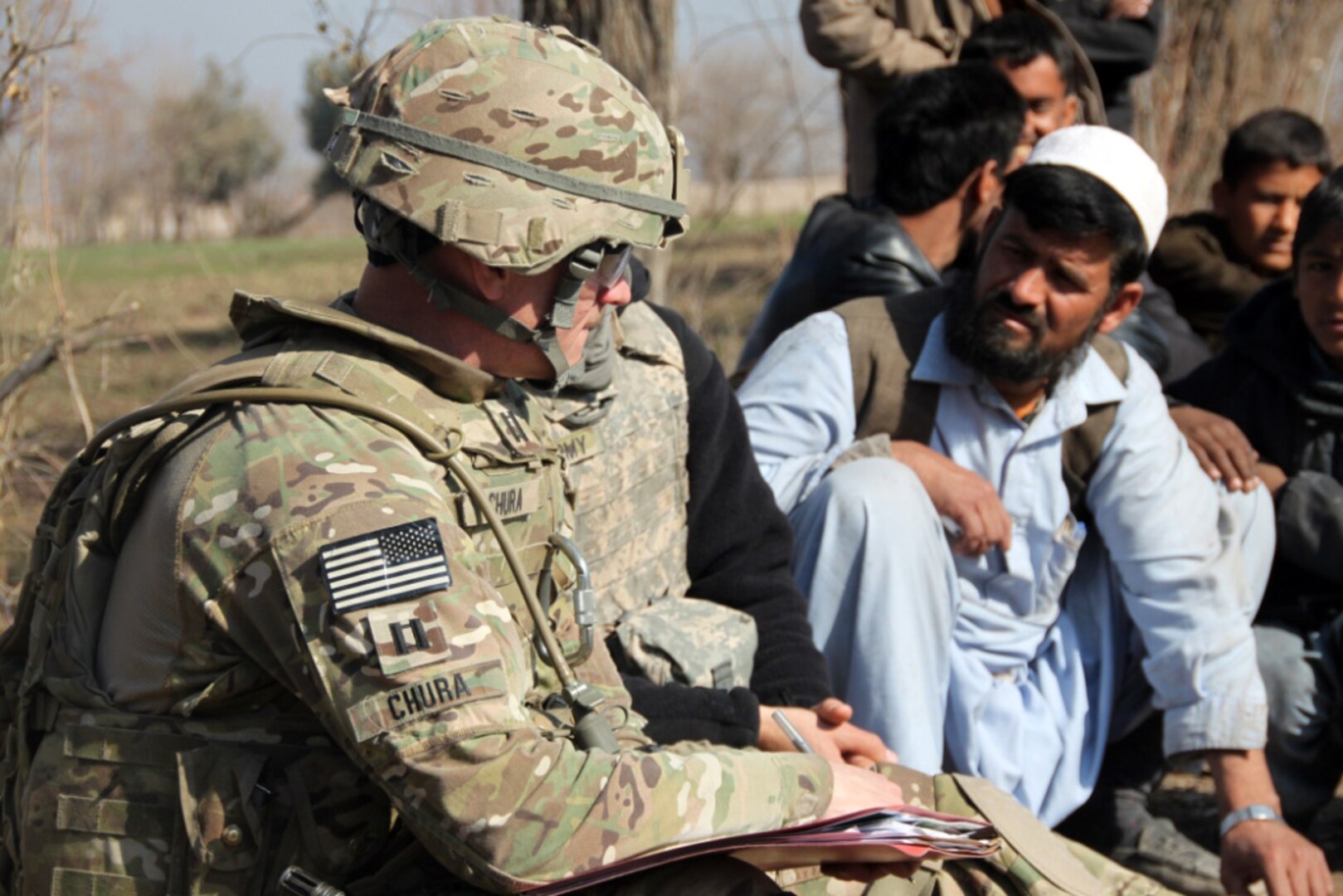 Capt. Gary Chura, an agribusiness specialist with the Missouri National Guard ADT V, serves as a mentor-trainer, coaching Afghan farmers in project management skills Jan. 23, 2012. Chura said he seeks to improve the business practices of farmers within his area of operation by providing mentorship during the execution of targeted projects aimed at building workforce capacity.